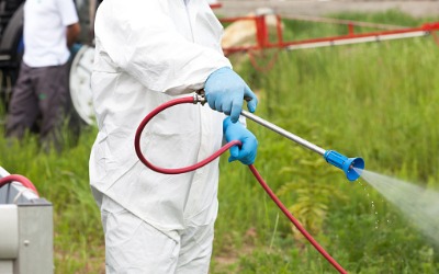 Man spraying chemicals for Mosquito Control in Peoria IL